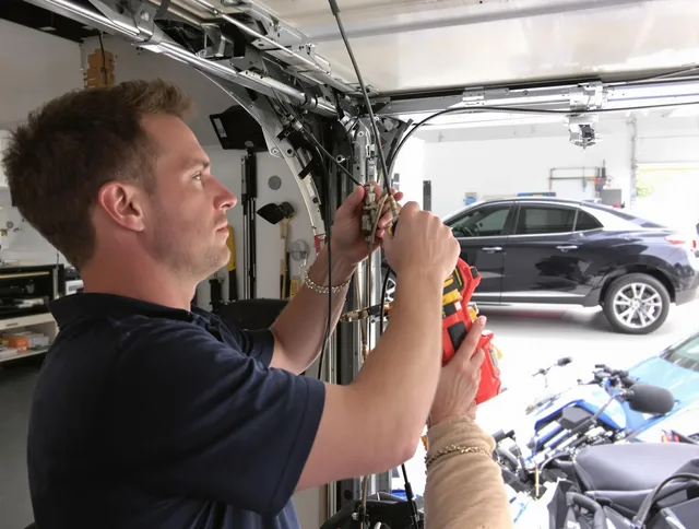 Wallingford Center Garage Door Repair safety certified technician performing cable replacement in Wallingford Center