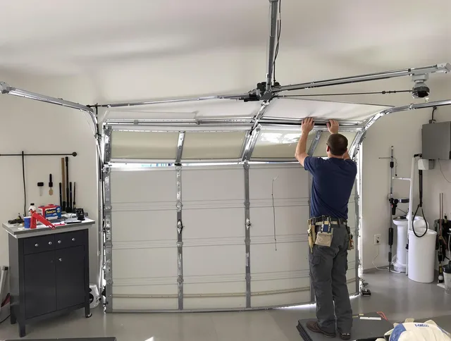 Wallingford Center Garage Door Repair specialist performing precise section replacement on Wallingford Center garage door